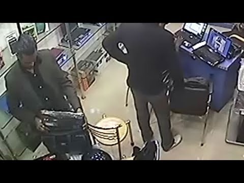 Professional Thief in Suit Stealing Laptop from Gadgets Store